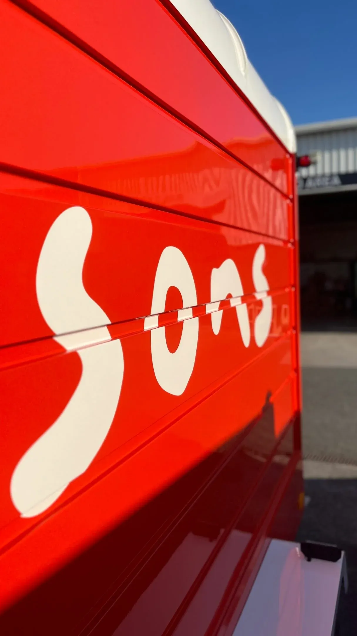 Close-up of the sons logo on the red trailer